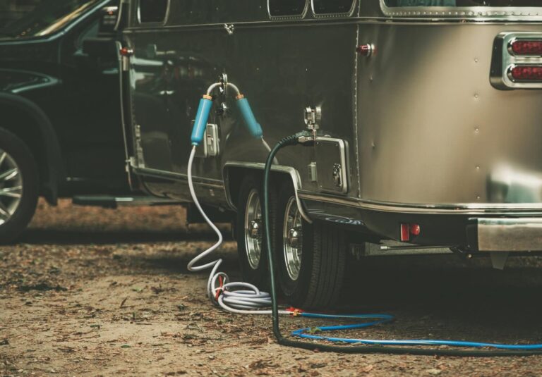 An RV connected to a home hookup setup