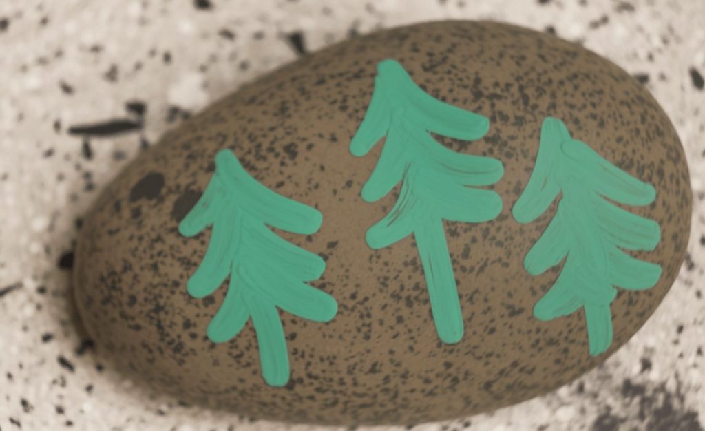 A painted stone that can be used a camping craft for kids
